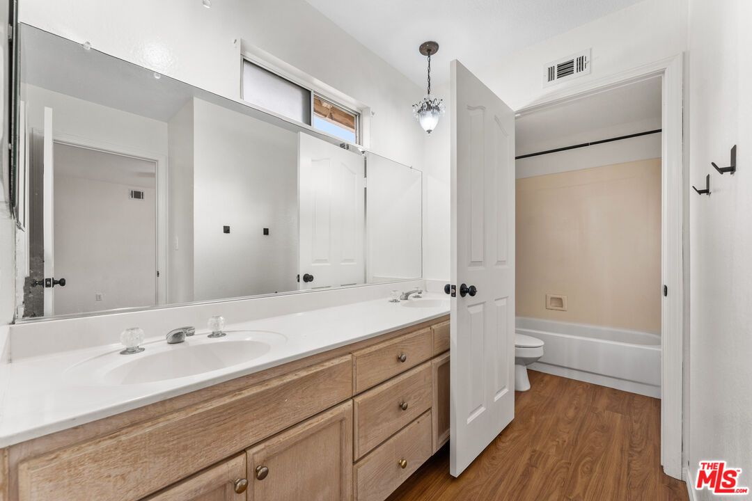 Bathroom, Dual Sink Vanities, Interior, Pendant Lights, Wood Texture Flooring