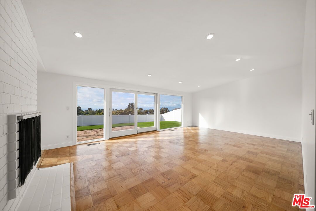 Empty room, Fireplace, Interior, Recessed Lighting, Water, Wood Texture Flooring