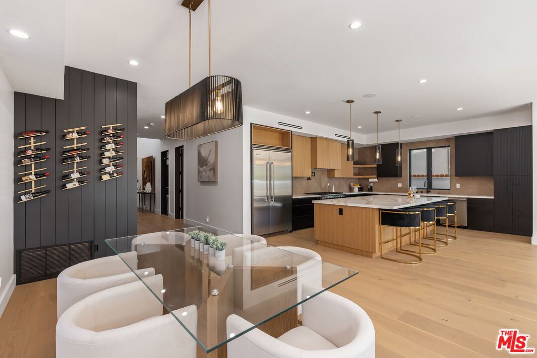 Dining room, Interior, Kitchen, Pendant Lights, Recessed Lighting, Stainless Steel Appliances, Wood Texture Flooring