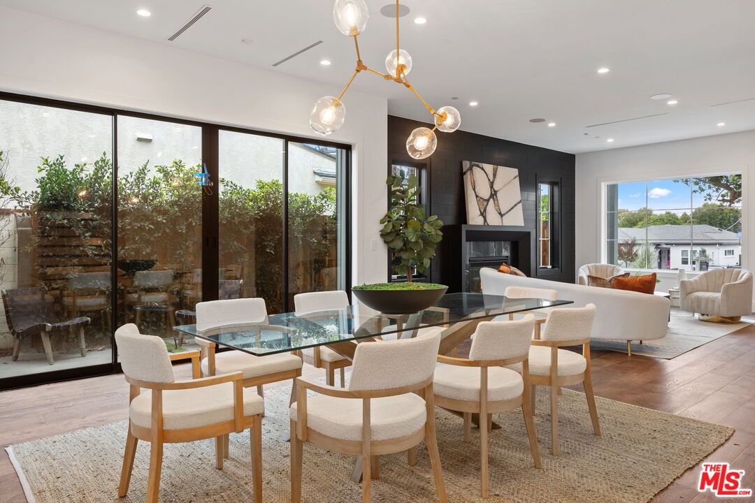 Dining room, Fireplace, Interior, Living room, Pendant Lights, Recessed Lighting, Wood Texture Flooring