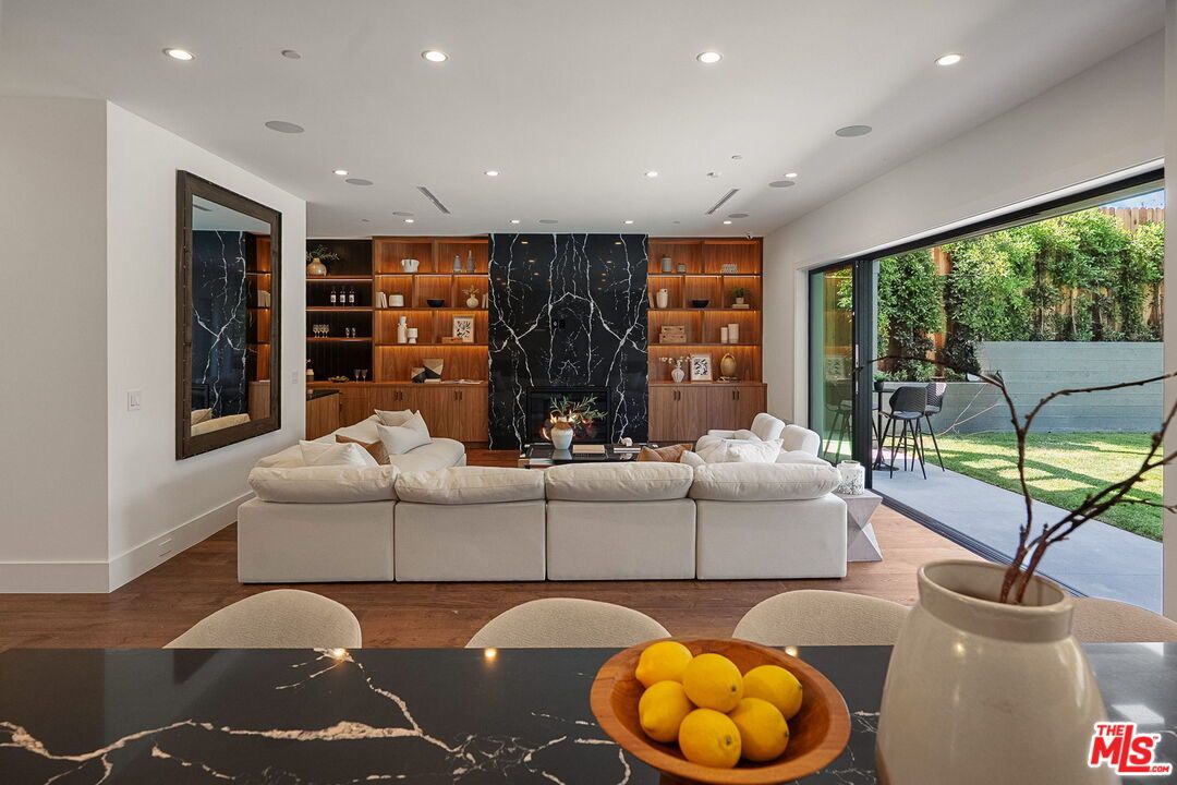 Fireplace, Interior, Living room, Marble Walls, Recessed Lighting, Wood Texture Flooring