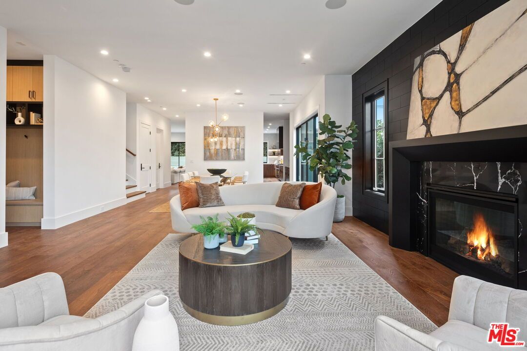 Dining room, Fireplace, Interior, Living room, Pendant Lights, Recessed Lighting, Wood Texture Flooring