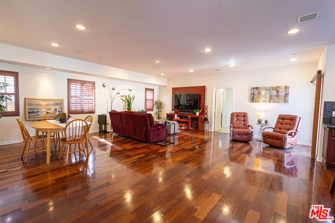 Dining room, Fireplace, Interior, Living room, Recessed Lighting, Wood Texture Flooring
