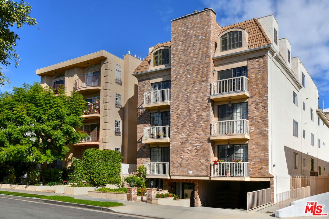 Exterior, Facade, Brick Facade, Condo Building