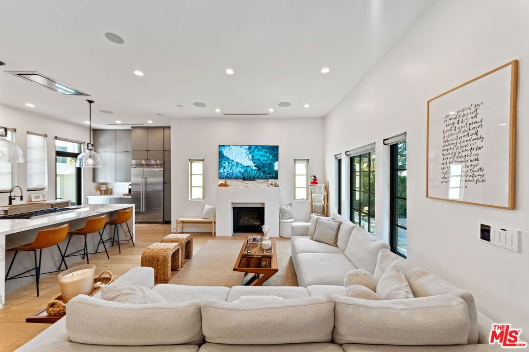 Fireplace, Interior, Kitchen, Living room, Pendant Lights, Recessed Lighting, Stainless Steel Appliances, Wood Texture Flooring