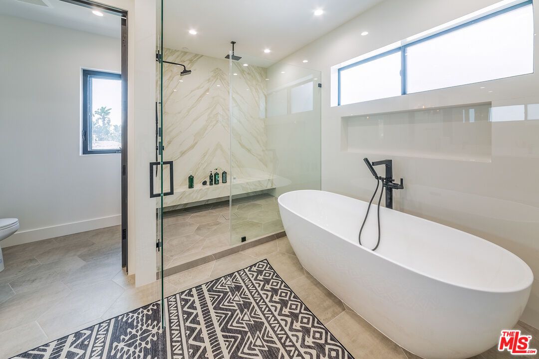 Bathroom, Free Standing Baths, Glass Shower, Interior, Marble Walls, Recessed Lighting