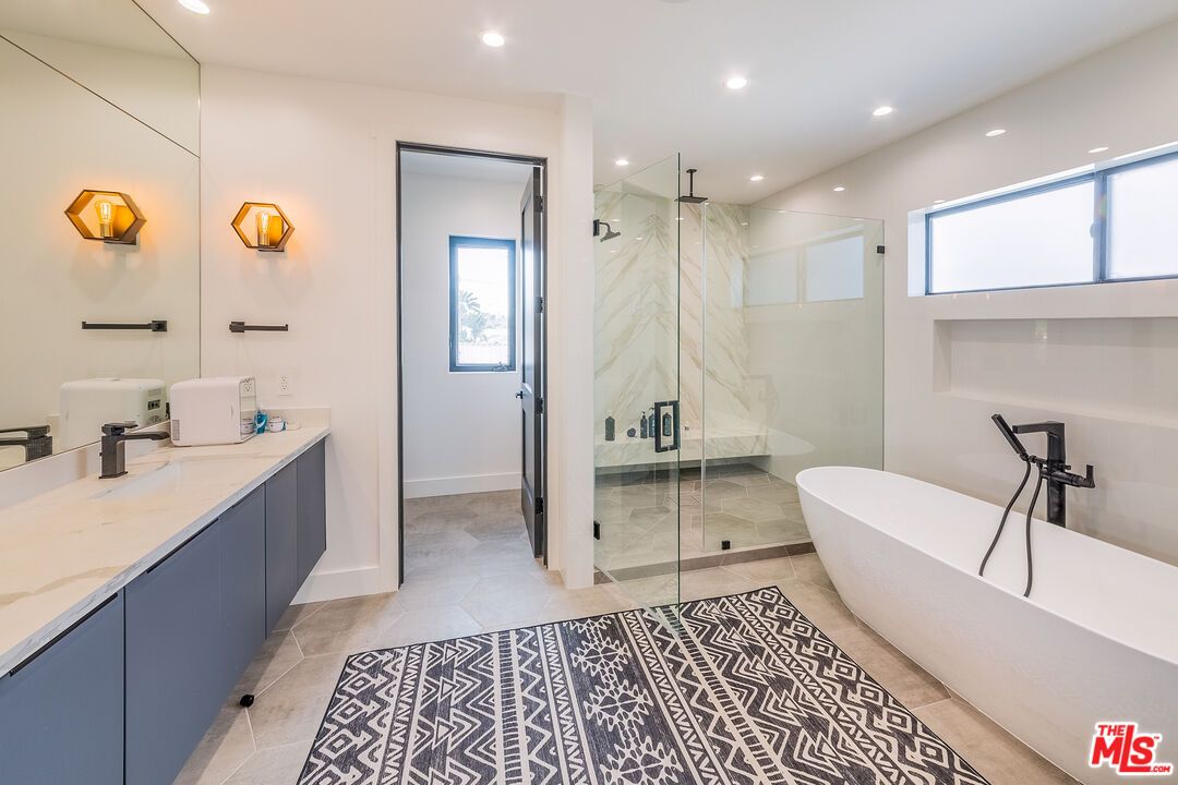 Bathroom, Dual Sink Vanities, Free Standing Baths, Glass Shower, Interior, Marble Walls, Recessed Lighting