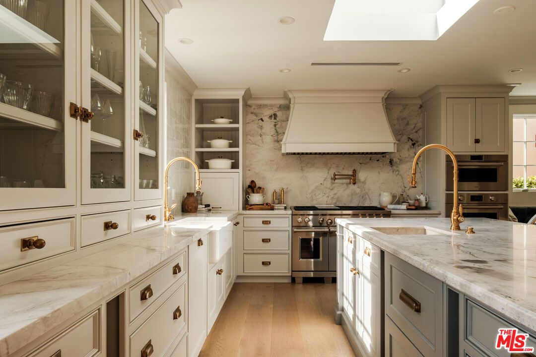 Interior, Kitchen, Marble Walls, Recessed Lighting, Stainless Steel Appliances, Wood Texture Flooring