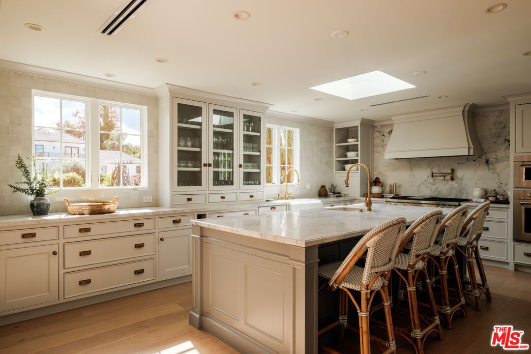 Interior, Kitchen, Marble Walls, Recessed Lighting, Stainless Steel Appliances, Wood Texture Flooring