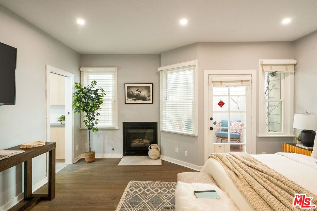 Bedroom, Fireplace, Interior, Recessed Lighting, Wood Texture Flooring