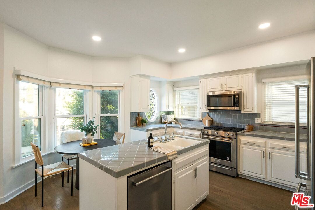 Interior, Kitchen, Recessed Lighting, Stainless Steel Appliances, Tile Countertops, Wood Texture Flooring