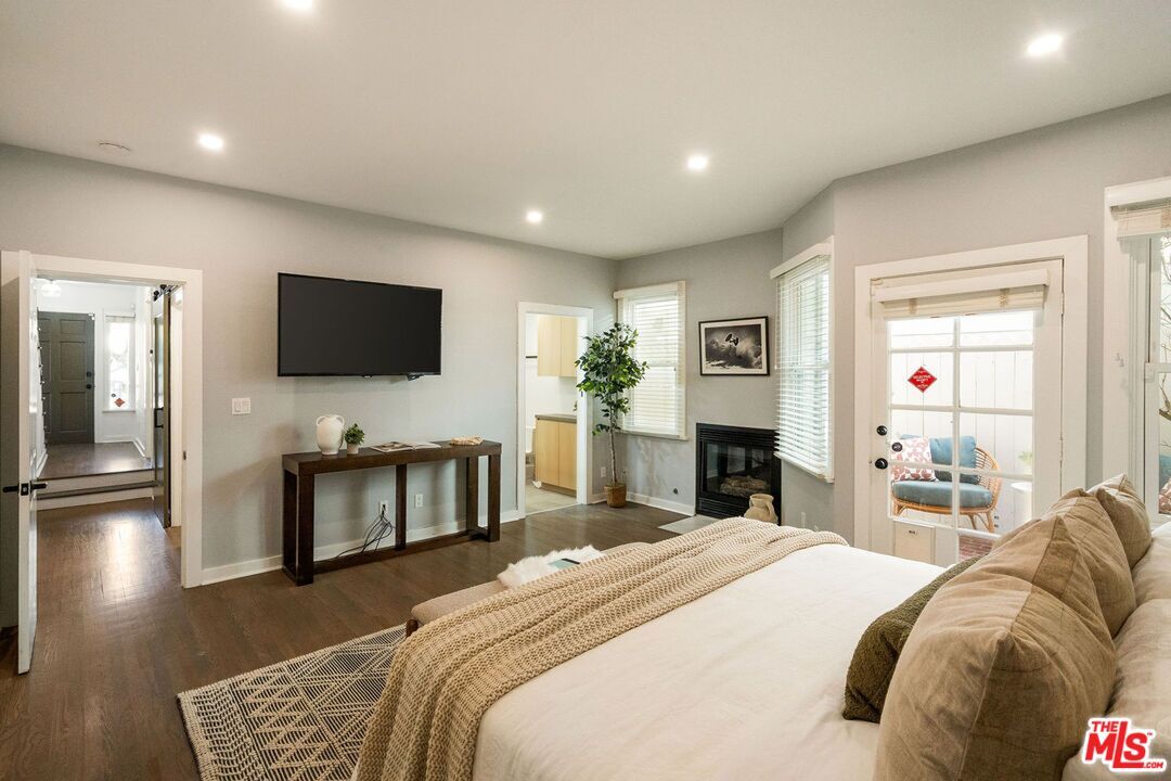 Bedroom, Fireplace, Interior, Recessed Lighting, Wood Texture Flooring