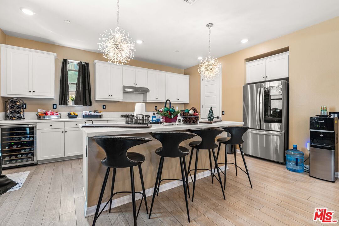 Chandelier, Interior, Kitchen, Pendant Lights, Recessed Lighting, Stainless Steel Appliances, Wood Texture Flooring