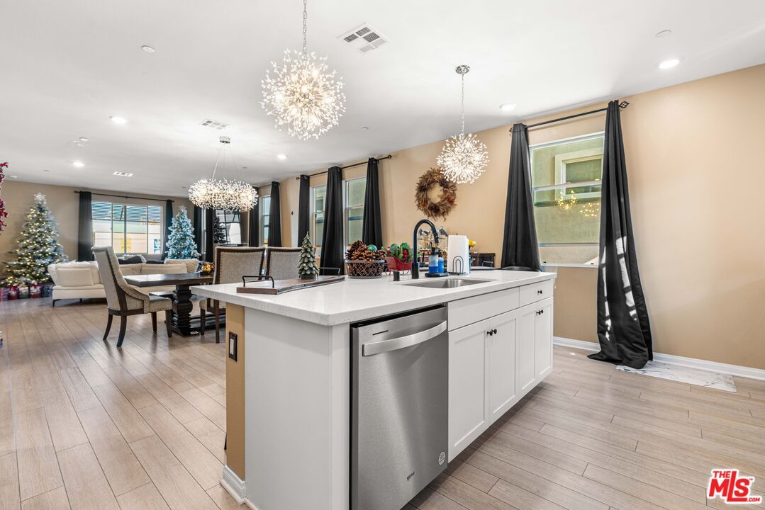 Chandelier, Dining room, Interior, Kitchen, Recessed Lighting, Stainless Steel Appliances, Wood Texture Flooring