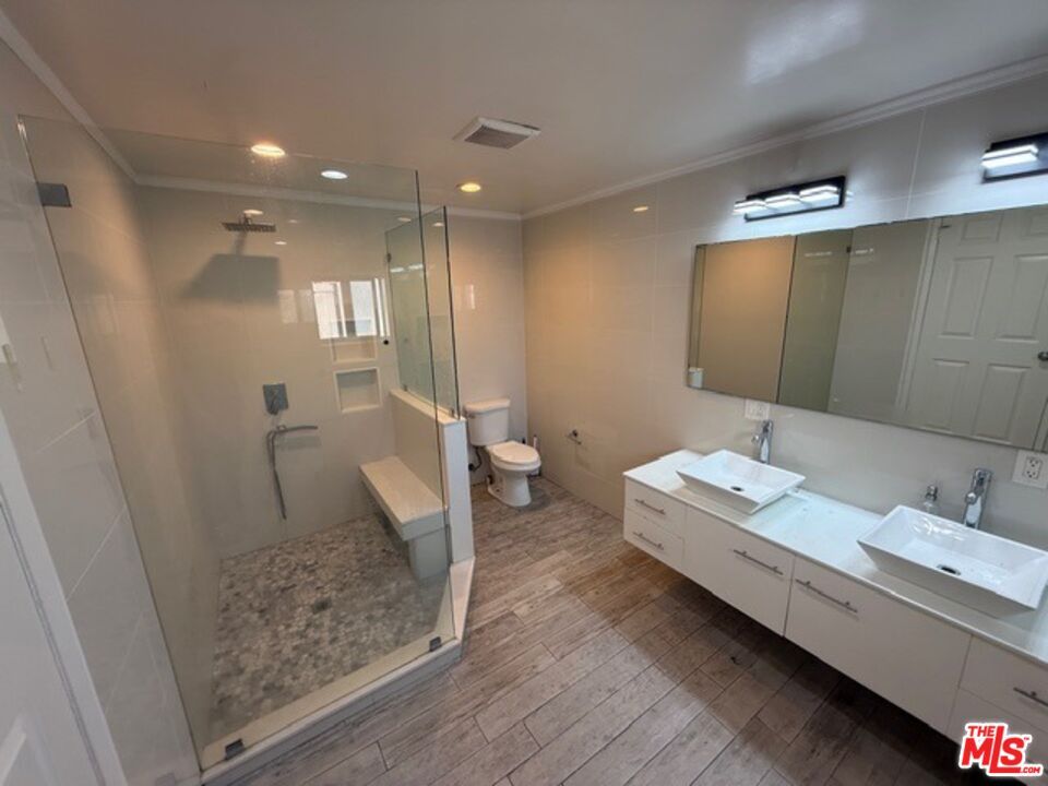 Bathroom, Dual Sink Vanities, Glass Shower, Interior, Recessed Lighting, Wood Texture Flooring