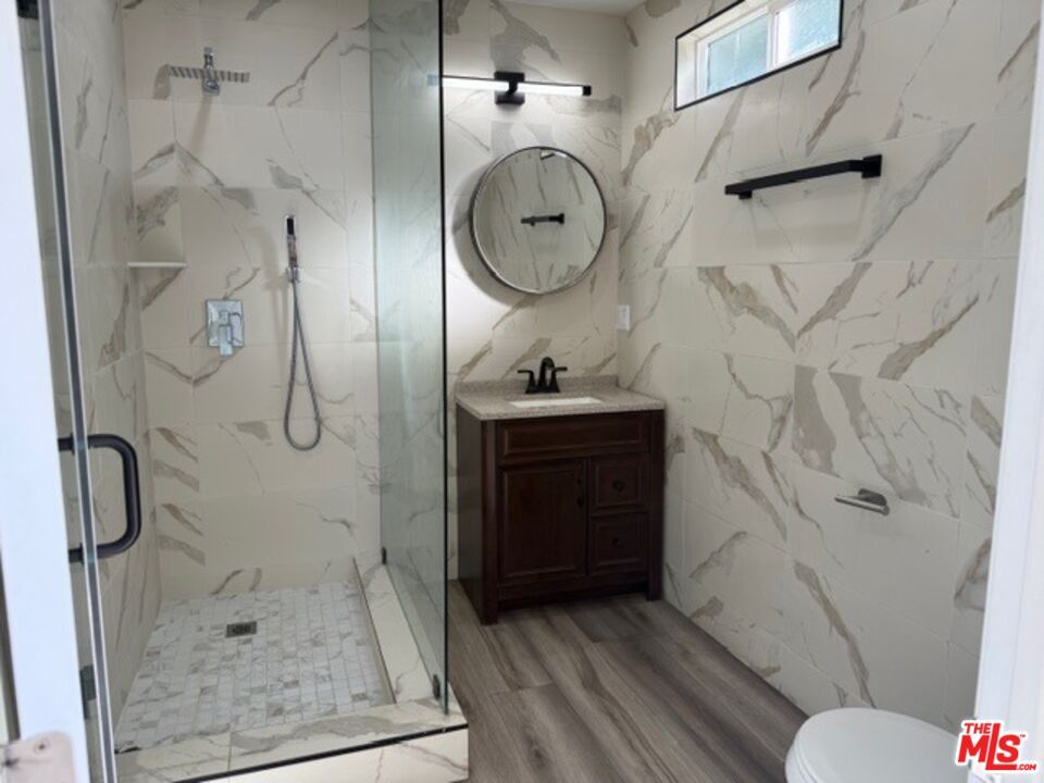 Bathroom, Glass Shower, Interior, Marble Walls, Wood Texture Flooring