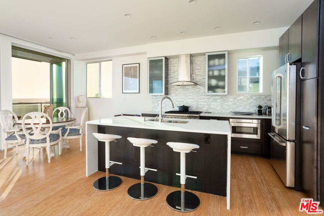 Dining room, Interior, Kitchen, Recessed Lighting, Stainless Steel Appliances, Wood Texture Flooring