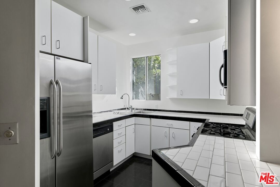 Interior, Kitchen, Recessed Lighting, Stainless Steel Appliances, Tile Countertops