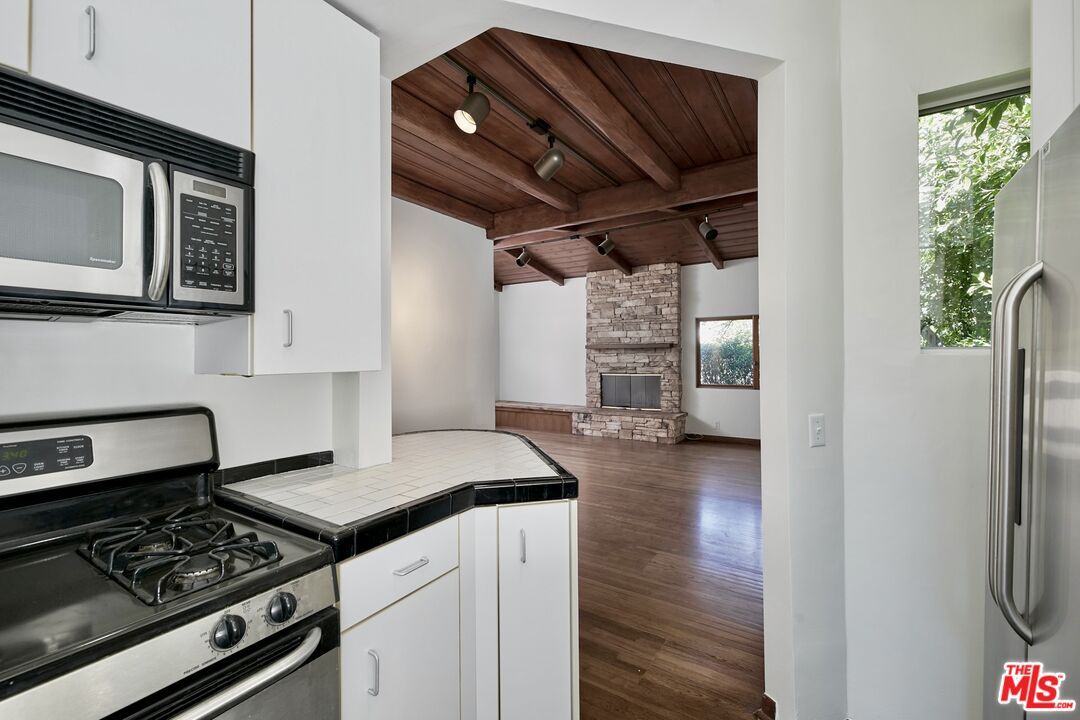 Fireplace, Interior, Kitchen, Stainless Steel Appliances, Wooden Beams, Wooden Ceilings, Wood Texture Flooring