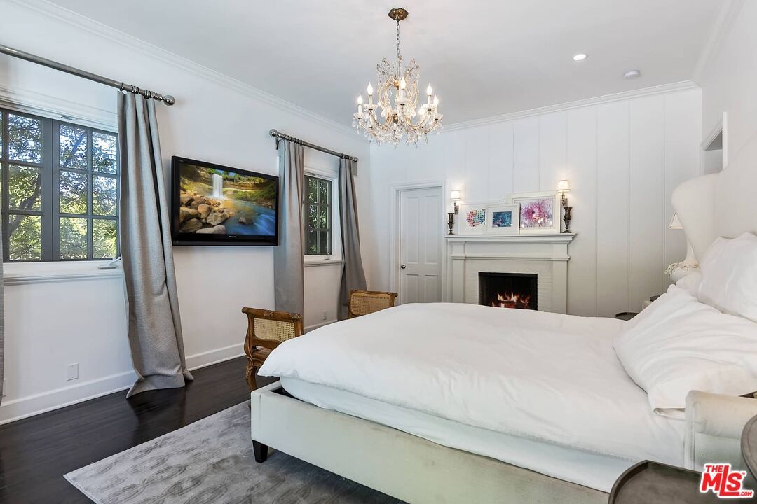 Bedroom, Chandelier, Fireplace, Interior, Recessed Lighting, Wood Texture Flooring
