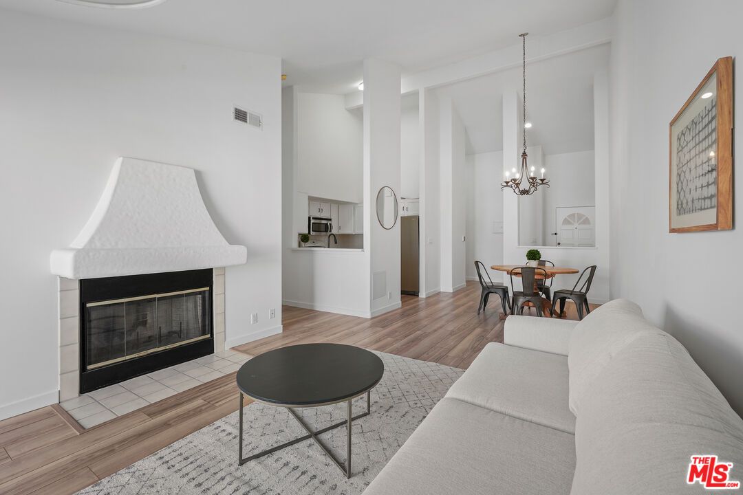 Chandelier, Dining room, Fireplace, Interior, Living room, Pendant Lights, Wood Texture Flooring