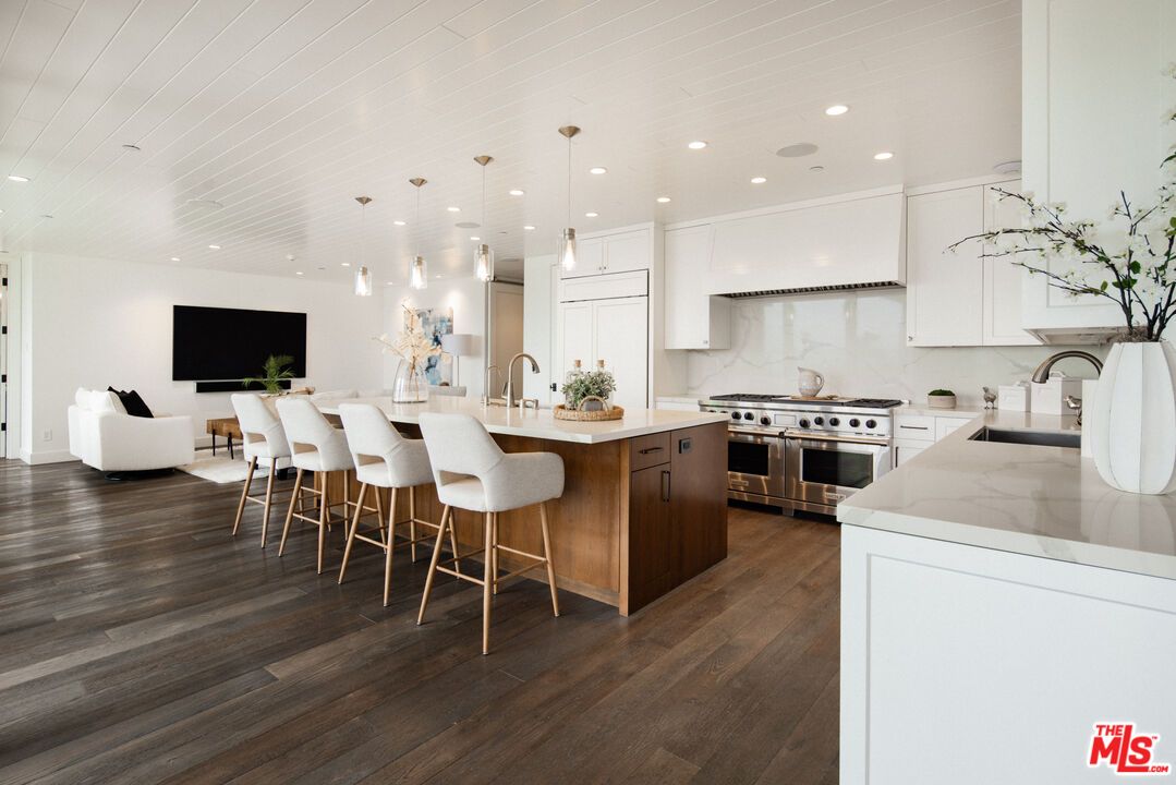 Interior, Kitchen, Marble Walls, Pendant Lights, Recessed Lighting, Stainless Steel Appliances, Wood Texture Flooring