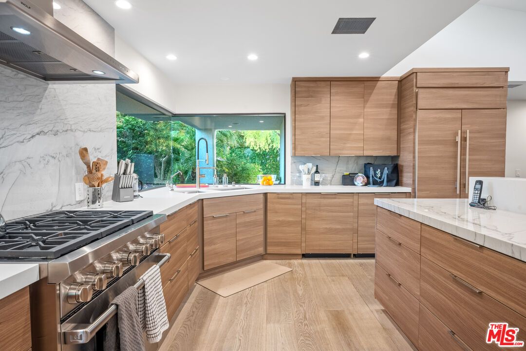 Interior, Kitchen, Marble Walls, Recessed Lighting, Stainless Steel Appliances, Wood Texture Flooring