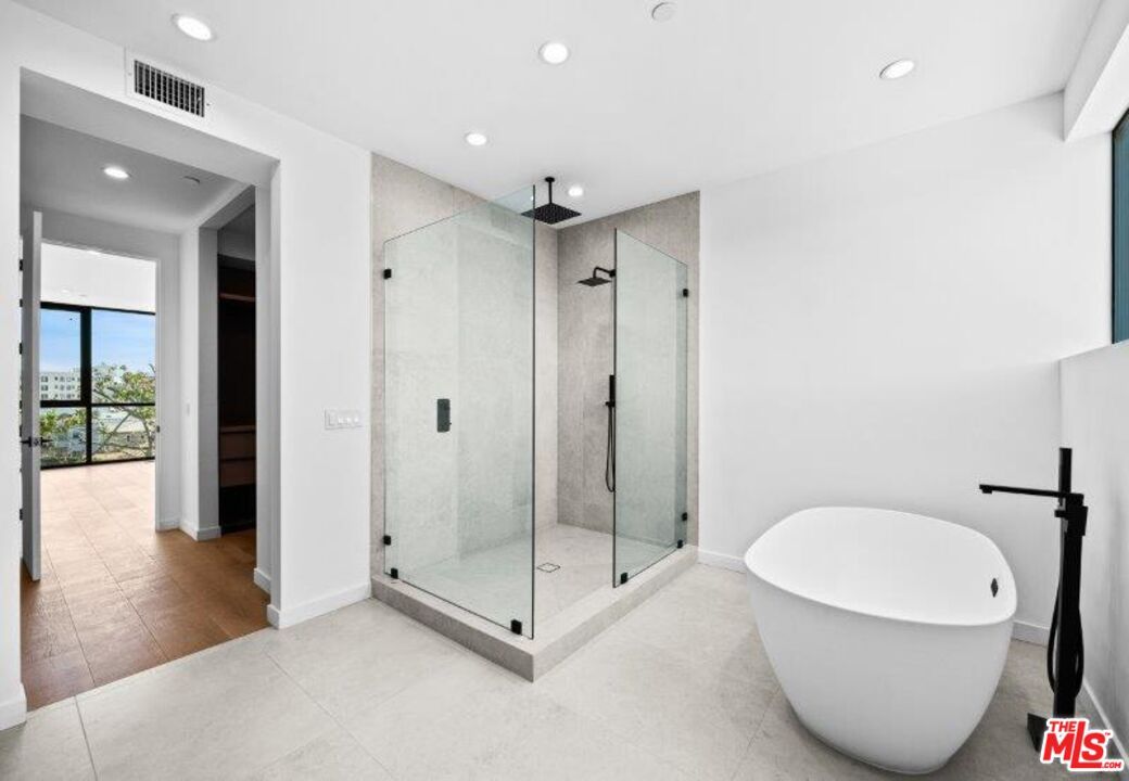 Bathroom, Free Standing Baths, Glass Shower, Interior, Recessed Lighting, Wood Texture Flooring