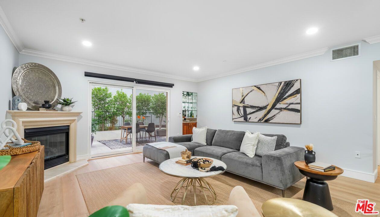 Dining room, Fireplace, Interior, Living room, Recessed Lighting, Wood Texture Flooring