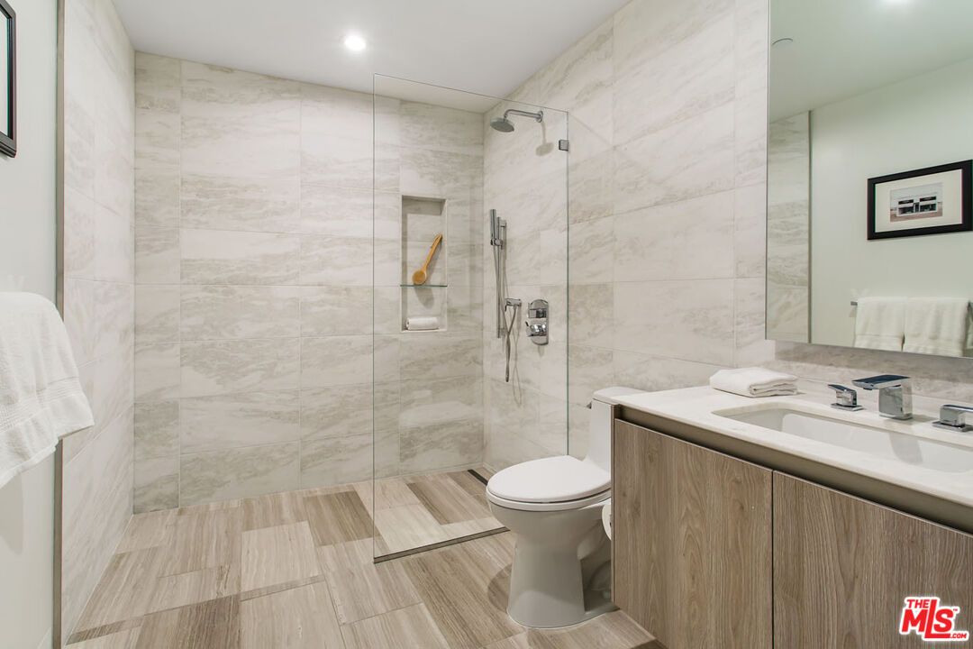 Bathroom, Glass Shower, Interior, Marble Walls, Recessed Lighting, Wood Texture Flooring