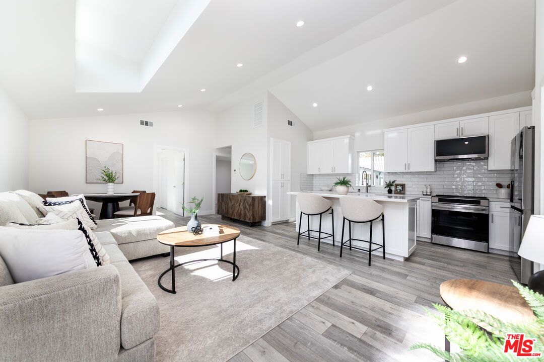 Dining room, Interior, Kitchen, Living room, Recessed Lighting, Stainless Steel Appliances, Wood Texture Flooring