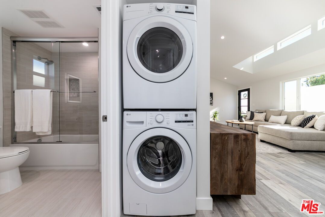 Bathroom, Glass Shower, Interior, Recessed Lighting, Utility Closets, Washer, Wood Texture Flooring