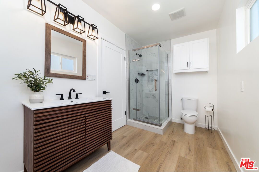 Bathroom, Glass Shower, Interior, Marble Walls, Recessed Lighting, Wood Texture Flooring