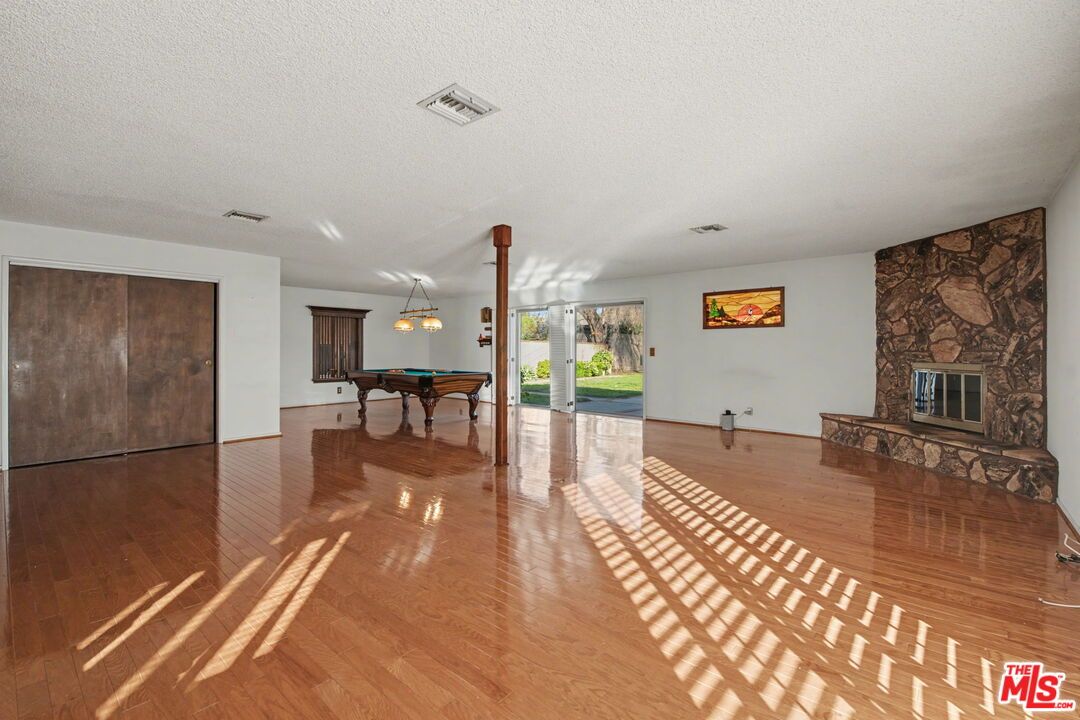 Dining room, Fireplace, Interior, Pendant Lights, Stone Walls, Wood Texture Flooring