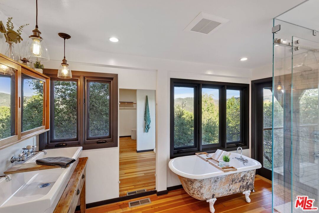 Bathroom, Free Standing Baths, Glass Shower, Interior, Pendant Lights, Recessed Lighting, Wood Texture Flooring