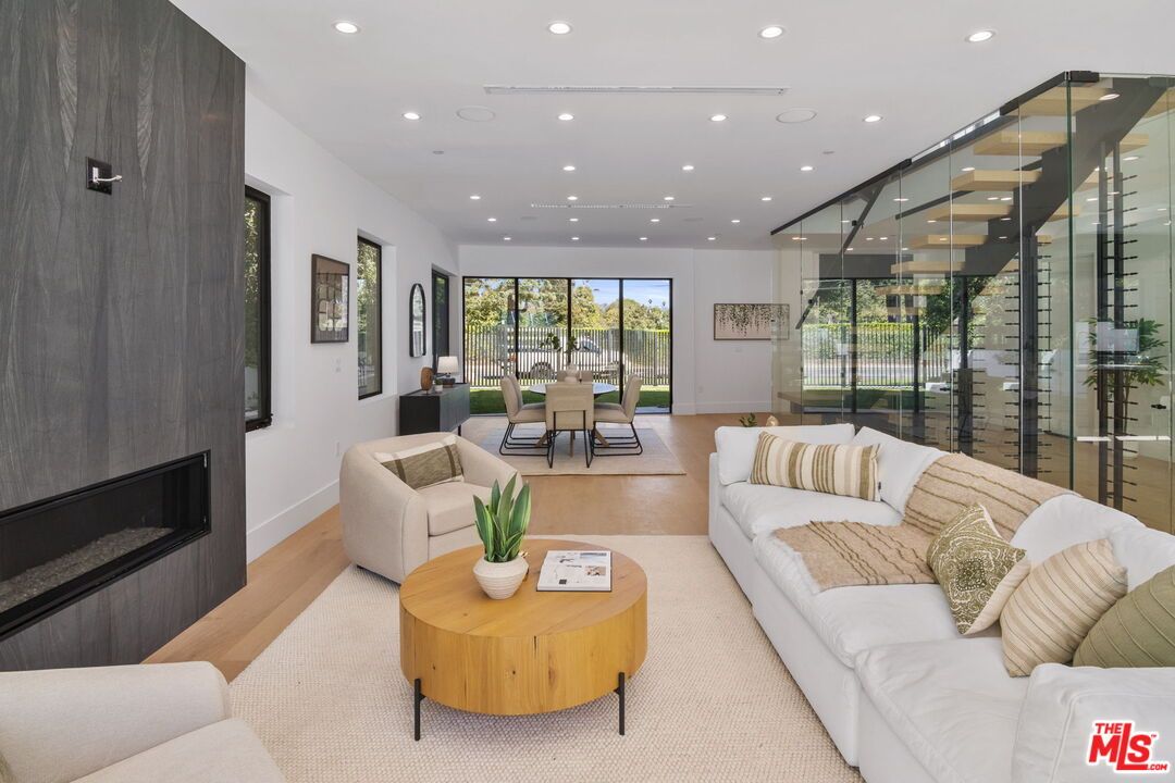 Dining room, Fireplace, Interior, Living room, Recessed Lighting, Wood Texture Flooring