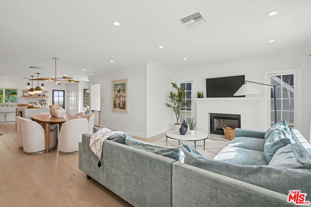 Dining room, Fireplace, Interior, Living room, Pendant Lights, Recessed Lighting, Wood Texture Flooring