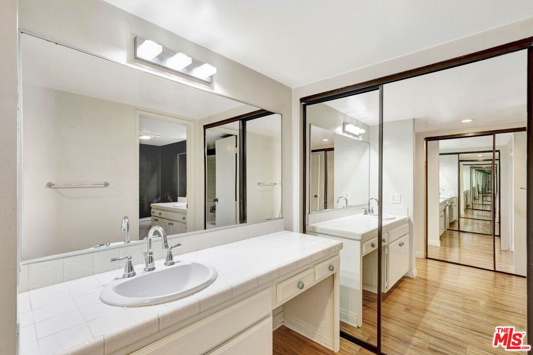 Bathroom, Dual Sink Vanities, Interior, Recessed Lighting, Tile Countertops, Wood Texture Flooring