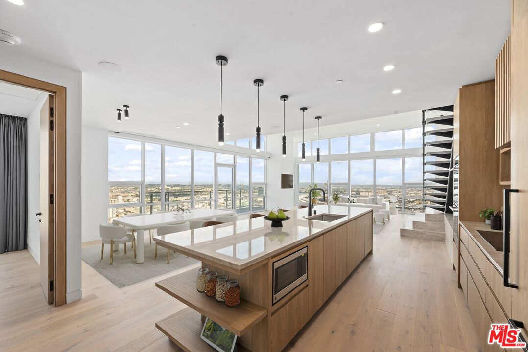 Dining room, Interior, Kitchen, Pendant Lights, Recessed Lighting, Stainless Steel Appliances, Water, Wood Texture Flooring