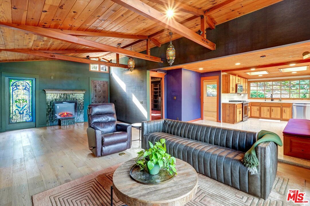 Fireplace, Interior, Kitchen, Living room, Pendant Lights, Recessed Lighting, Stainless Steel Appliances, Wooden Beams, Wooden Ceilings, Wood Texture Flooring