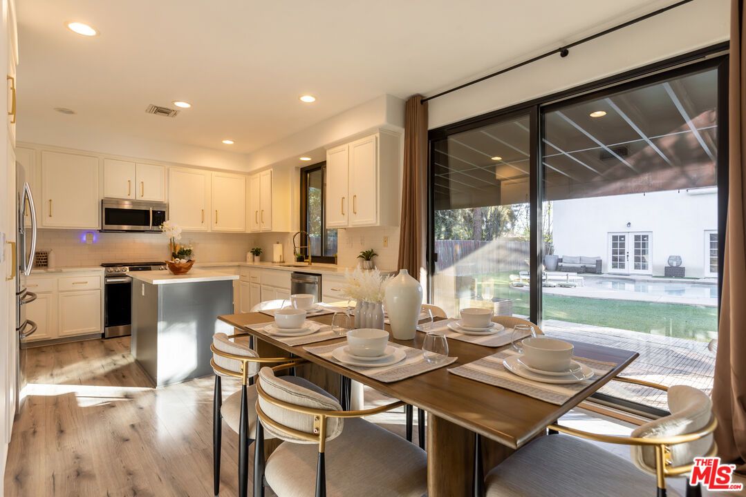 Dining room, Interior, Kitchen, Recessed Lighting, Stainless Steel Appliances, Water, Wood Texture Flooring