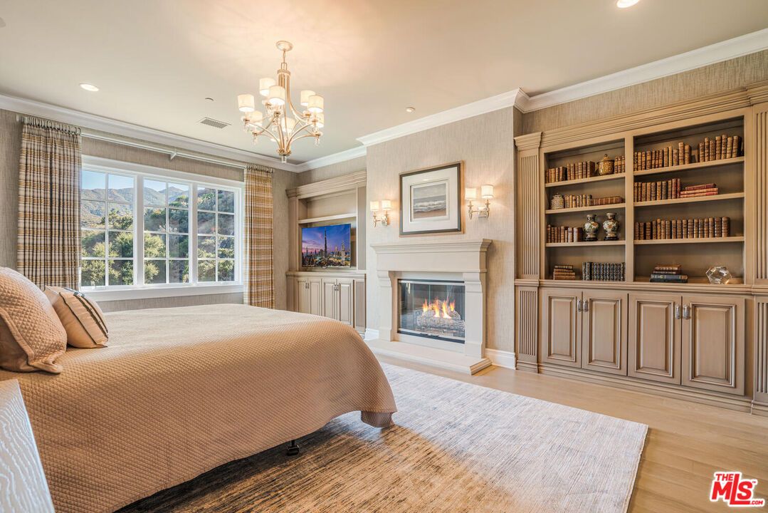 Bedroom, Chandelier, Fireplace, Interior, Recessed Lighting, Wood Texture Flooring