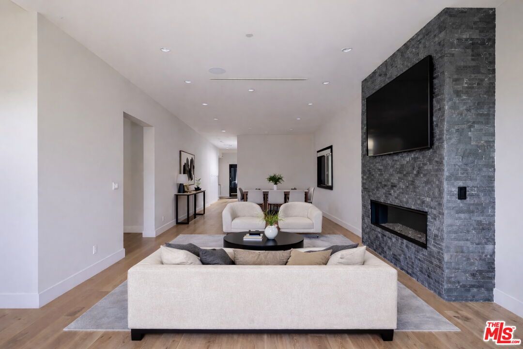 Dining room, Fireplace, Interior, Living room, Recessed Lighting, Wood Texture Flooring