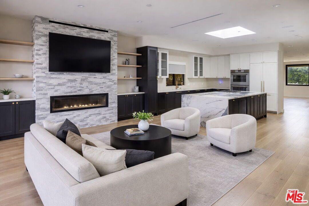 Fireplace, Interior, Kitchen, Living room, Recessed Lighting, Stainless Steel Appliances, Stone Walls, Wood Texture Flooring