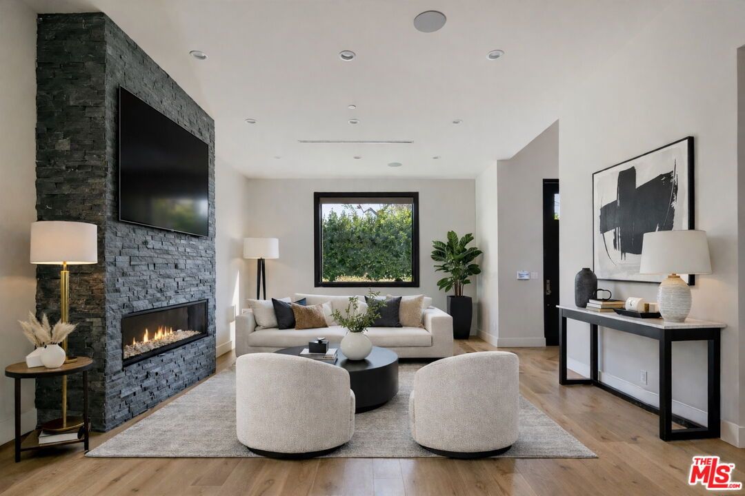 Fireplace, Interior, Living room, Recessed Lighting, Stone Walls, Wood Texture Flooring