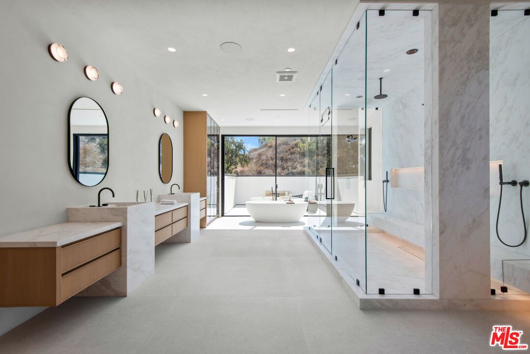 Bathroom, Dual Sink Vanities, Free Standing Baths, Glass Shower, Interior, Marble Walls, Recessed Lighting