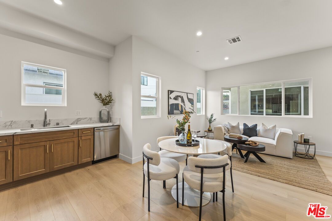 Dining room, Interior, Kitchen, Living room, Recessed Lighting, Stainless Steel Appliances, Wood Texture Flooring