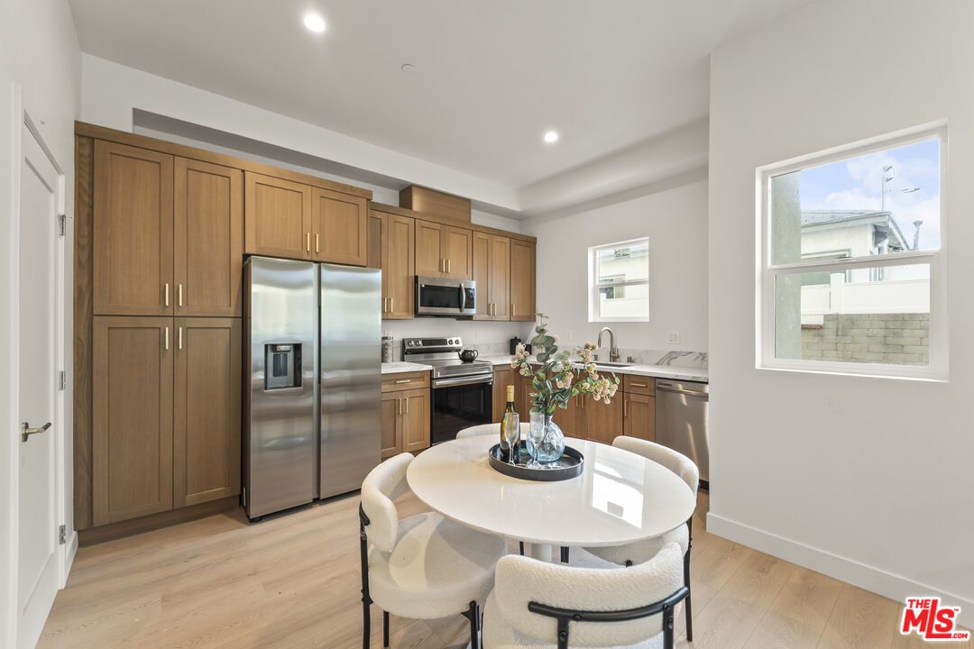 Dining room, Interior, Kitchen, Recessed Lighting, Stainless Steel Appliances, Wood Texture Flooring