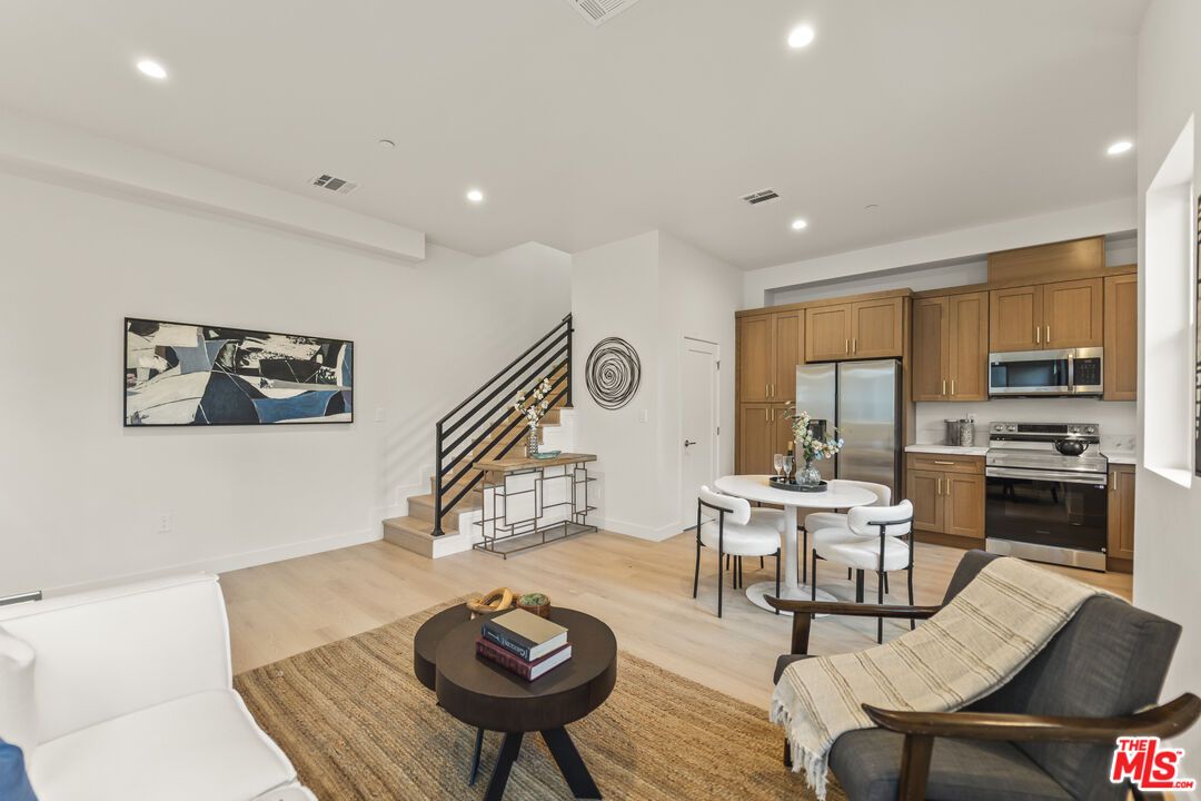Dining room, Interior, Kitchen, Living room, Recessed Lighting, Stainless Steel Appliances, Wood Texture Flooring