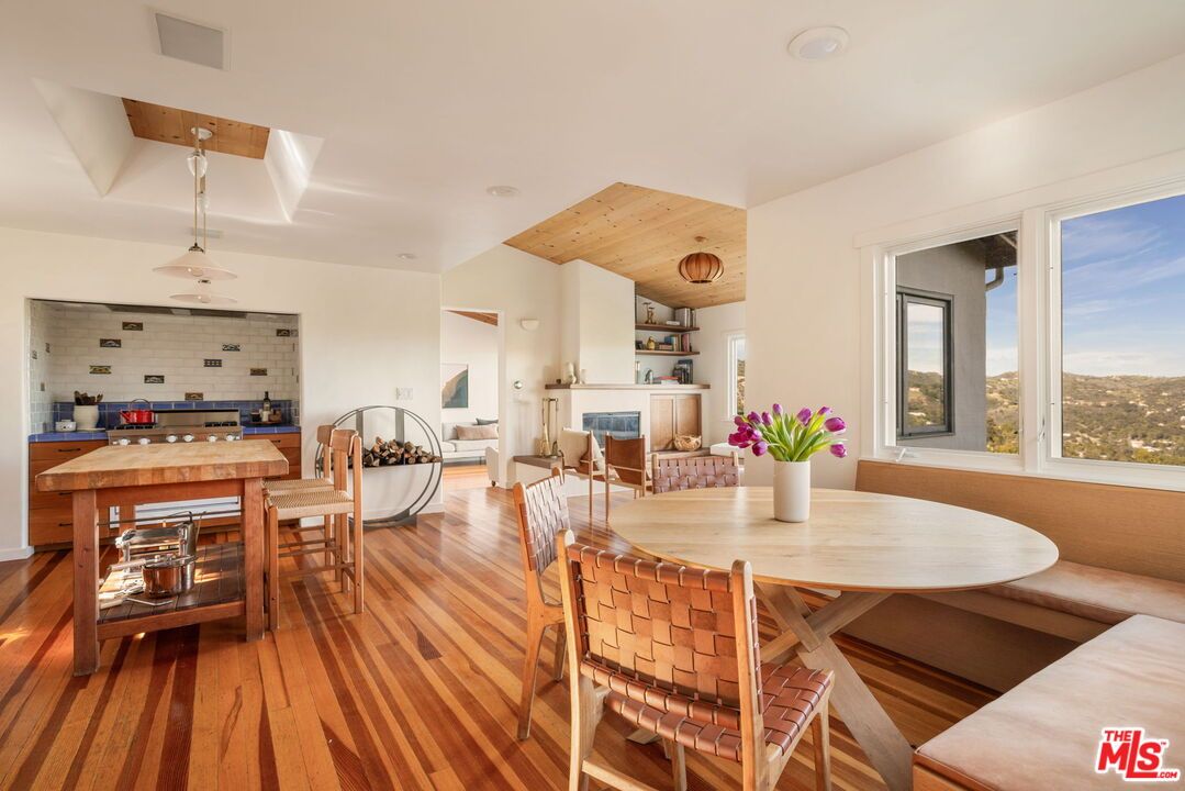 Dining room, Fireplace, Interior, Recessed Lighting, Stone Walls, Wooden Ceilings, Wood Texture Flooring